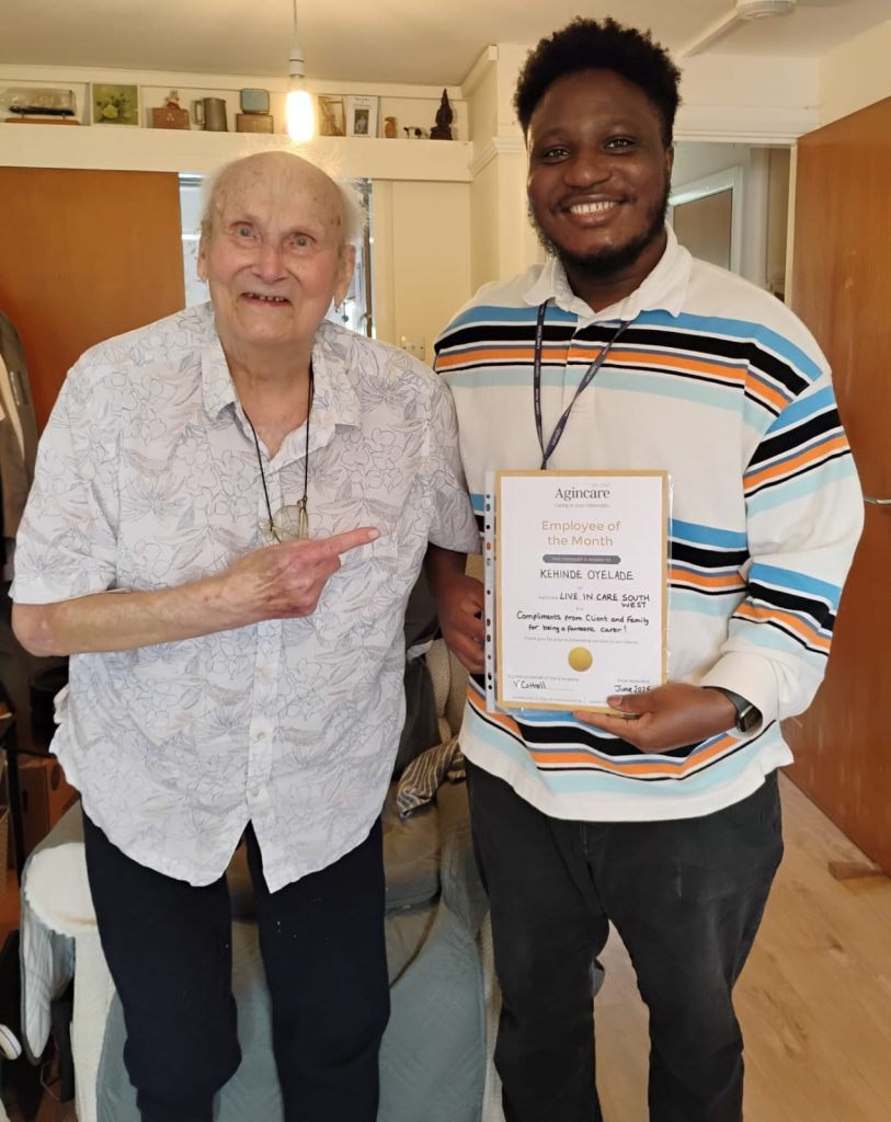 Live-in care client Ron with care worker Kenny