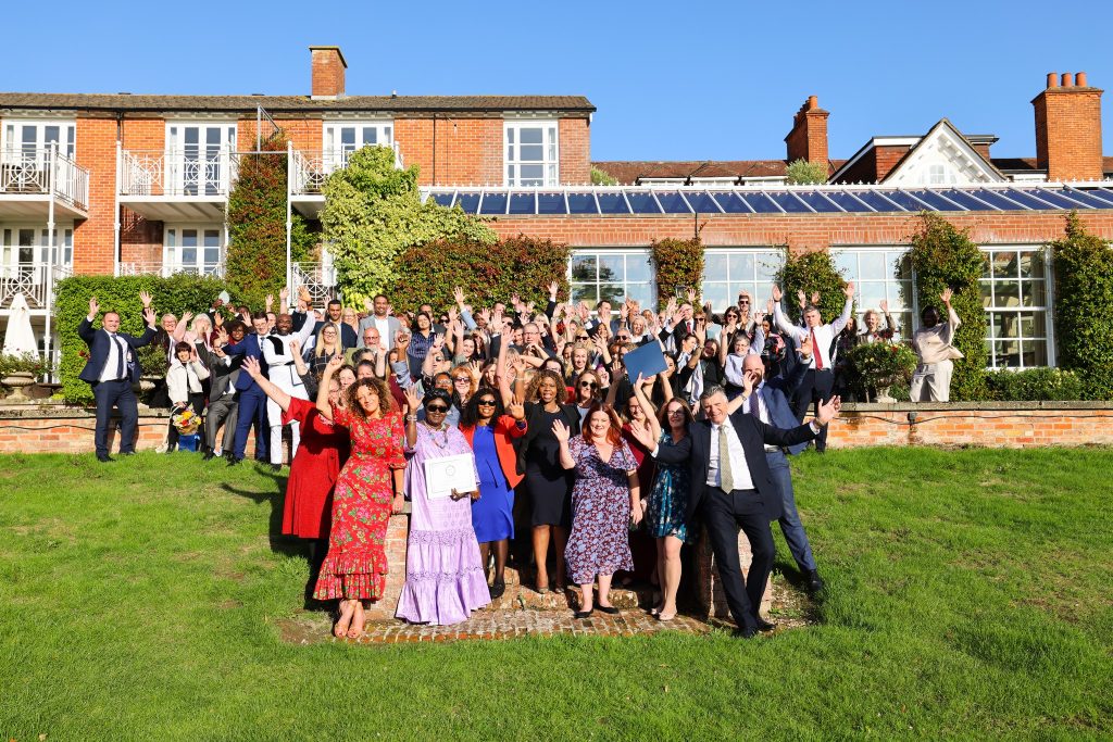 Guests at the Agncare Heroes Awards 2025 celebrate on the lawn at Chewton Glen Hotel and Spa in the New Forest